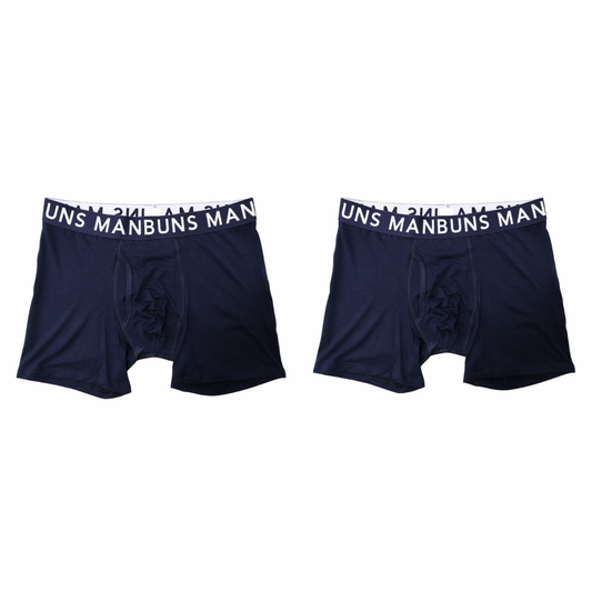 two navy blue manbuns boxer briefs with brand on waist band in front of a white background. 